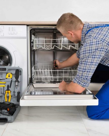 technician fixing a dishwasher repair roswell